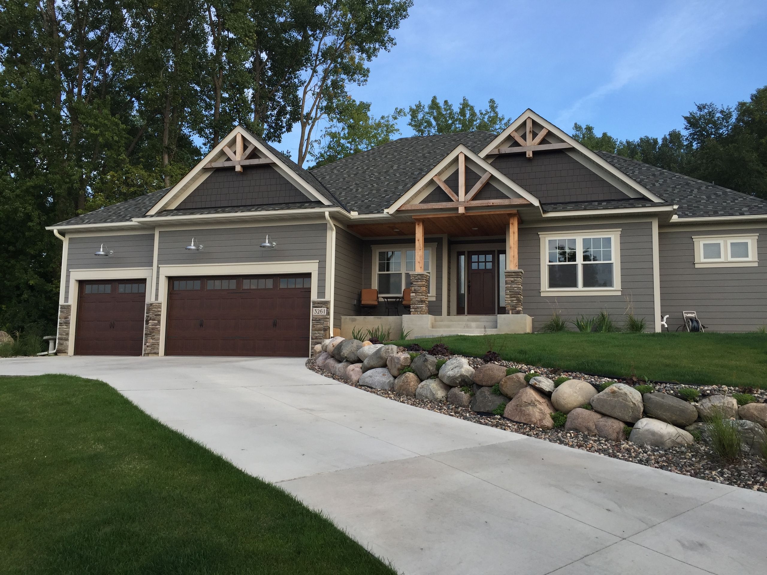 Craftsman ranch with shake gables, stone skirting, and a new shingle roof