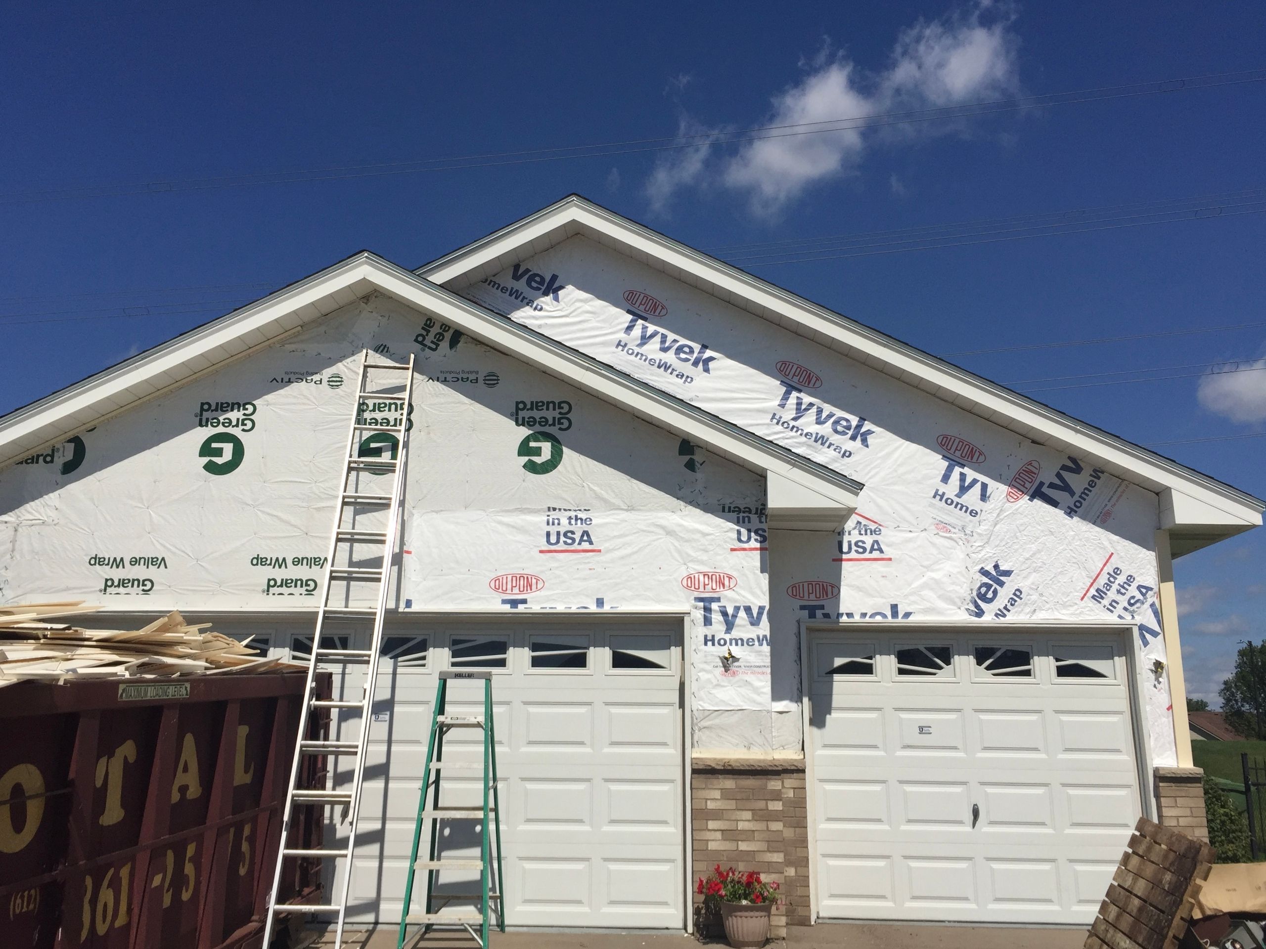 White soffit and fascia trim along a new roofline