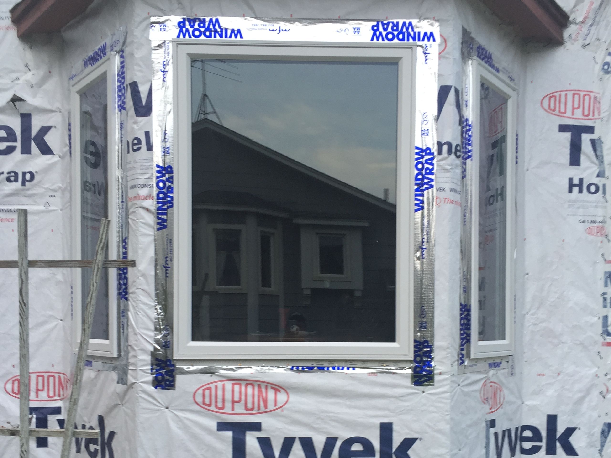 New window set and wrapped before the siding goes back on