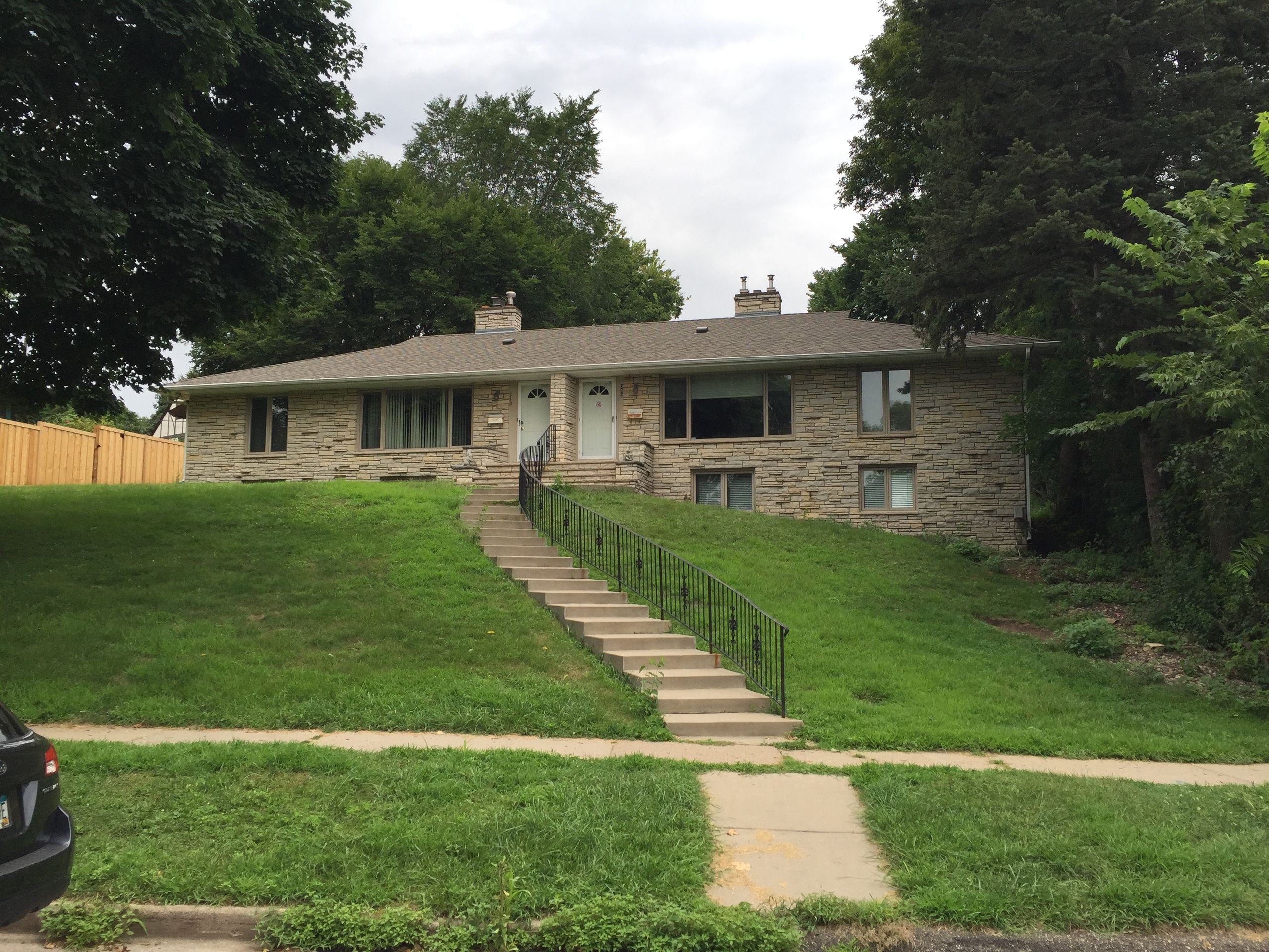 Stone rambler with new gutters and siding