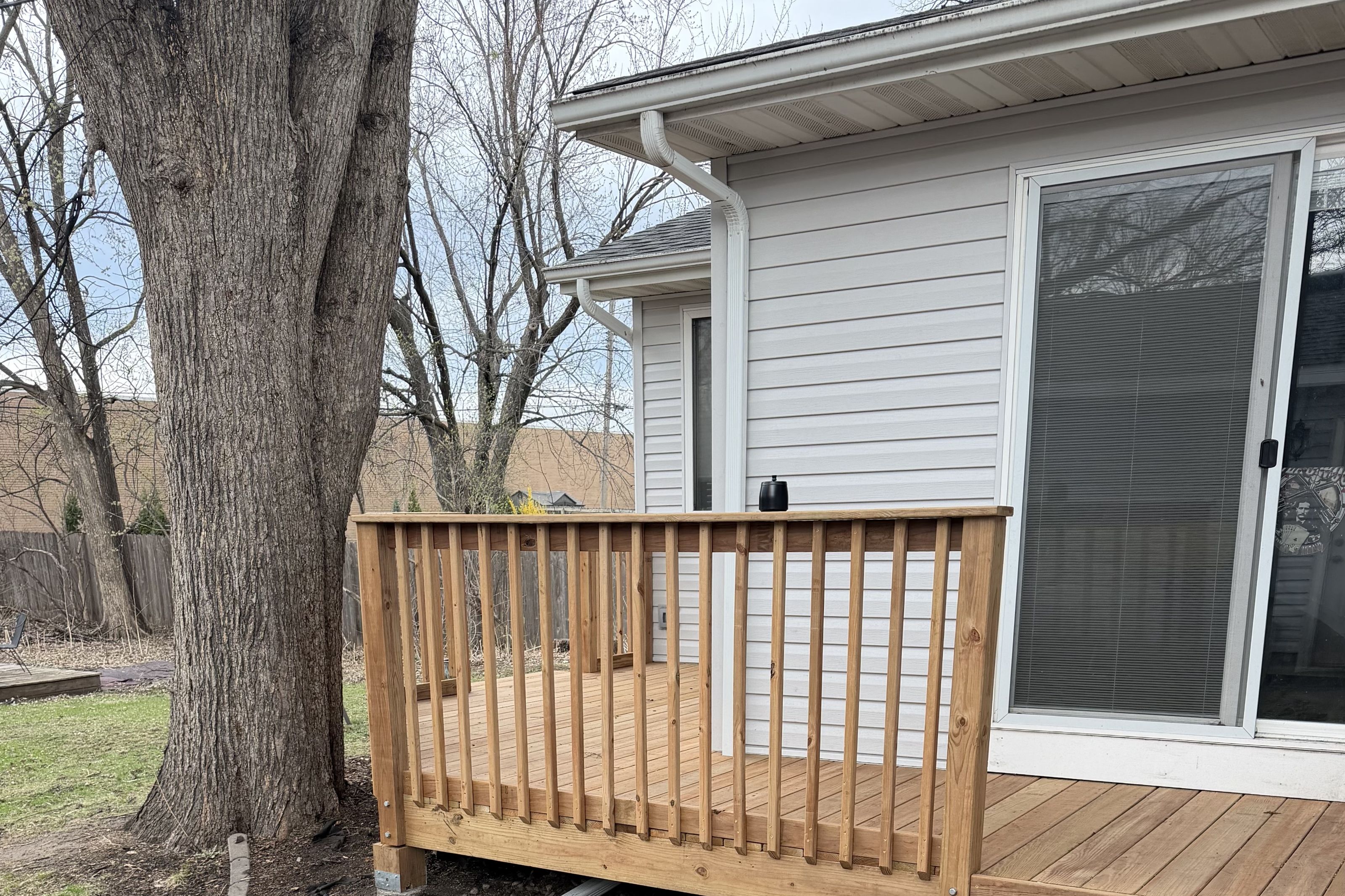 Sliding patio door opening onto a new backyard deck