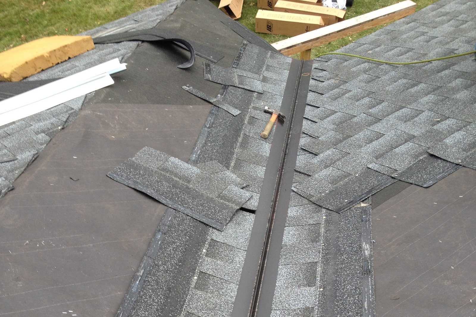 New shingles and ridge cap on a residential roof
