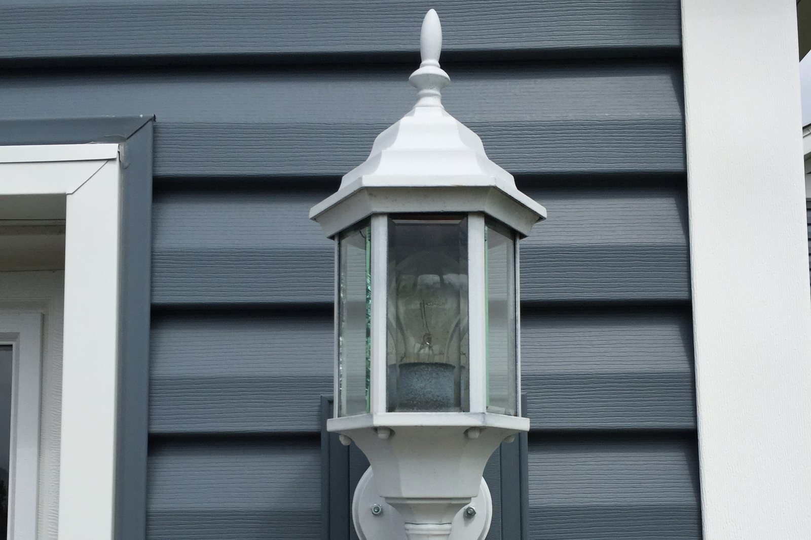 Exterior light fixture set into new trim and soffit