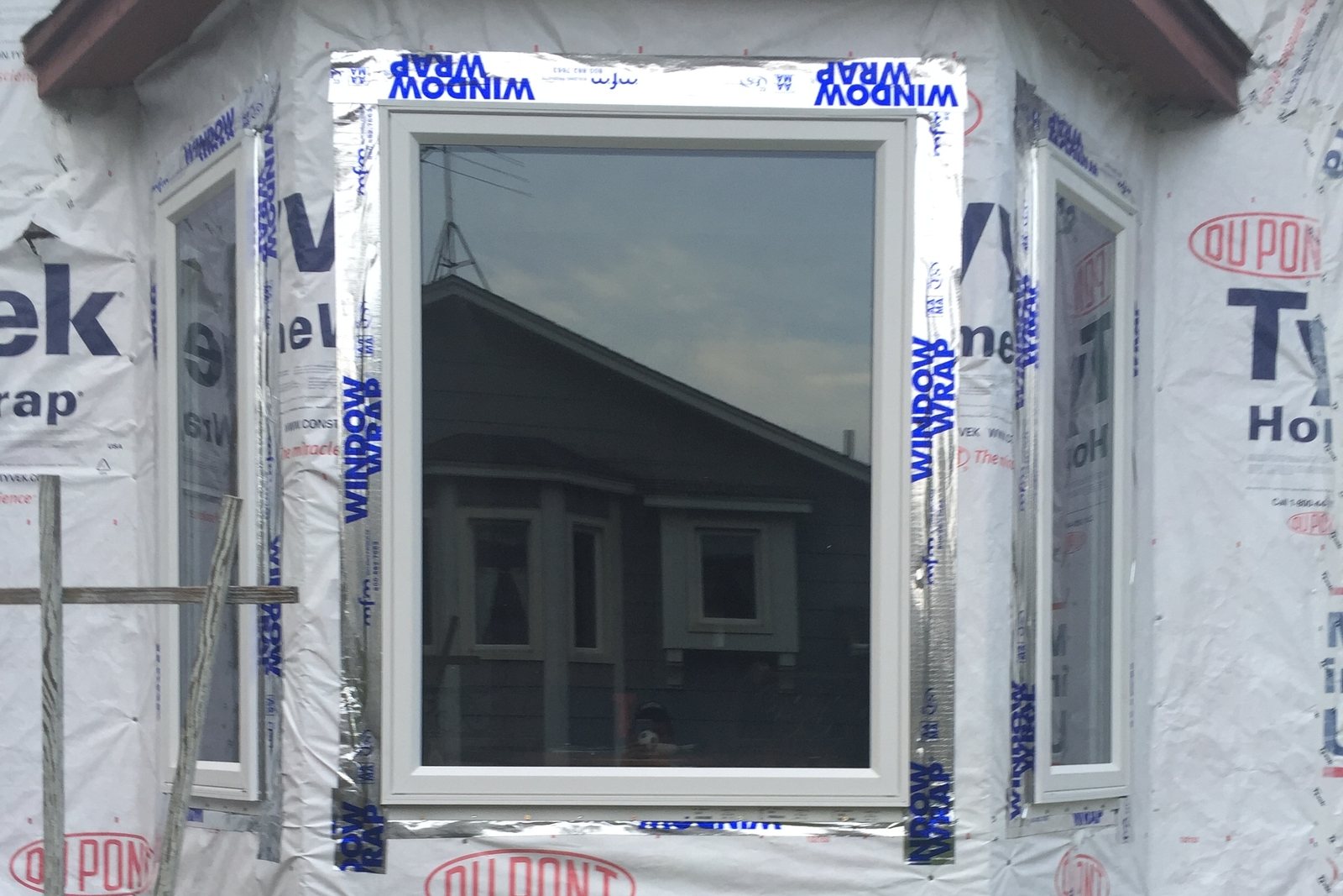 New replacement window with fresh aluminum trim wrap