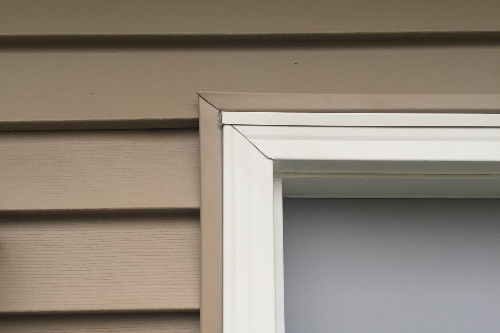 Close-up of finished trim around a replacement window